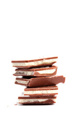 Broken yoghurt chocolate bars on white