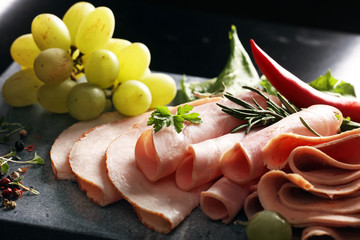 cold meat plate. Sliced ham with lettuce, shallow depth, selective focus 