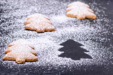 Christmas cookies and a silhouette of a tree