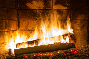 Close up shot of burning firewood in the fireplace