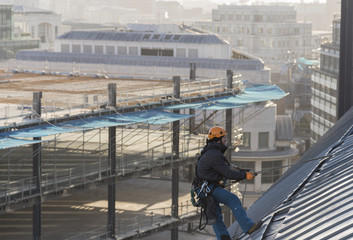 Industrial abseiler on the rooftop