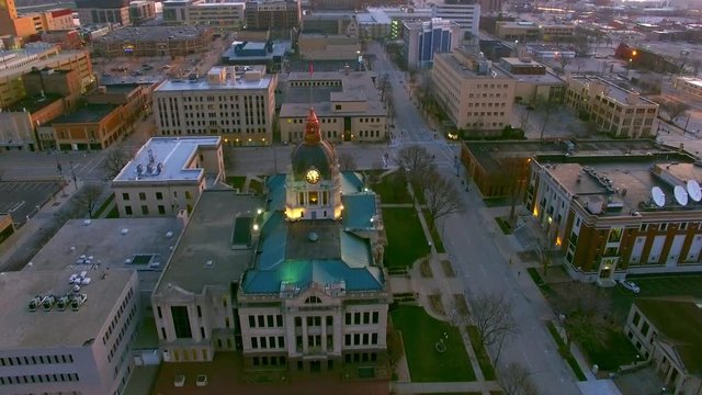 Stunning dawn aerial view of Courthouse, a flock of geese flies through adding interest and action.