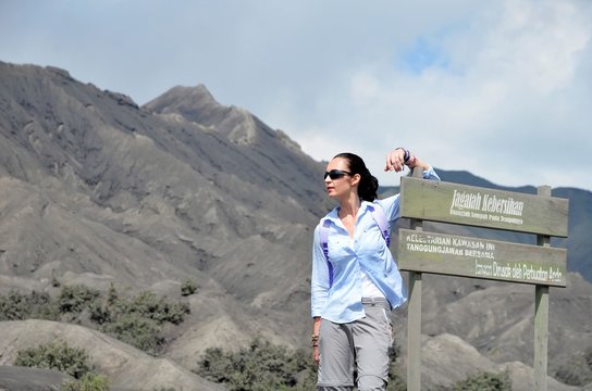 Woman on the top near volcano Bromo in Indonesia