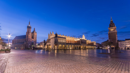 St Mary's church, Cloth Hall and Town Hall tower on the Main Market Square in Krakow, illuminated in the morning