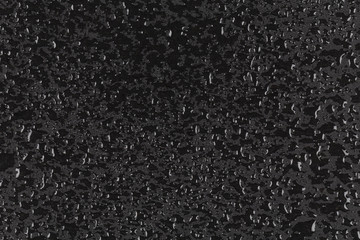 Water drops on dark stone surface