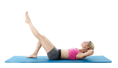 Young woman exercising on mat