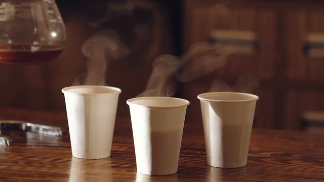 Three cups of delicious coffee on the wooden table