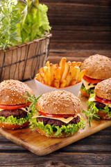 Hamburger with beef meat and fresh vegetables with empty space f