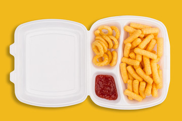 unhealthy eating concept on yellow