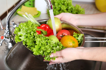Vegetables washing in the kitchen