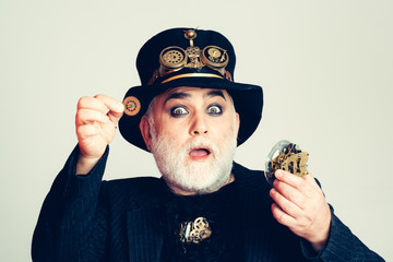 Amazed man keeps cogwheel