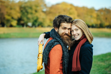 Fototapeta premium Young couple in autumn park