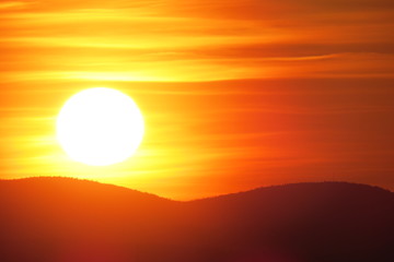 Cloudy sunset above the mountains. Quebec, Canada.