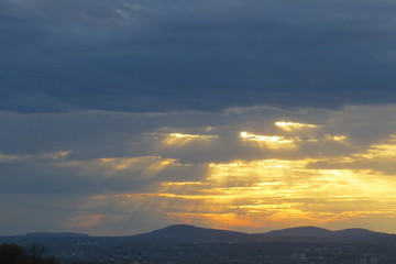 Rays of sunlight passing through clouds. Quebec, Canada.