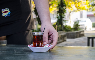 Waiter Serving Turkish Tea
