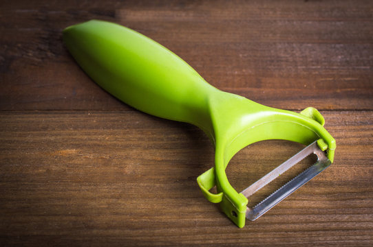 Vegetable Peeler On Wooden Table