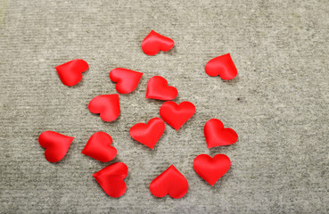 Red hearts on a gray background