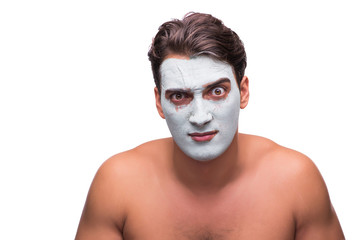 Man with mud mask isolated on white