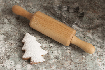 christmas gingerbread cookies baking process , dough and rolling pin,shallow depth of field.