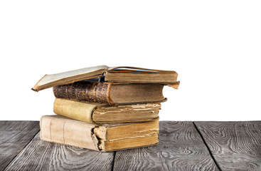Stack of old books on a wooden table