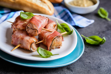 Roasted tuna meat pieces wrapped in bacon slices