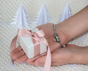 Silver bracelet with charms. Gift box for Christmas and New Year 2017.   Paper Christmas trees.