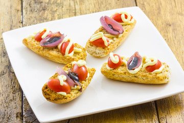 Tasty appetizer of canapes and vegetables