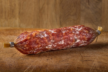 Italian salami on wooden cutting board