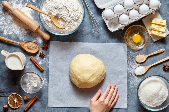 Dough mixing recipe bread, pizza or pie making ingridients, food flat lay on kitchen table background. Working with butter, milk, yeast, flour, eggs, sugar pastry or bakery cooking.