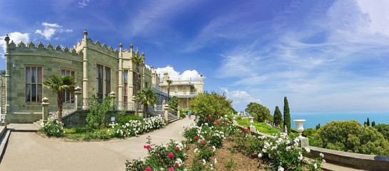 Fototapeta premium flower Beds with roses on the southern terraces of the Vorontsov Palace. Yalta, Alupka, Crimea, Russia