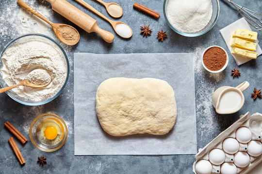 Dough preparation recipe homemade traditional bread, pizza or pie ingridients, food flat lay on kitchen table background. Working with butter, milk, yeast, flour, eggs, sugar pastry or bakery cooking