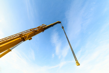 Yellow telescopic boom crane.