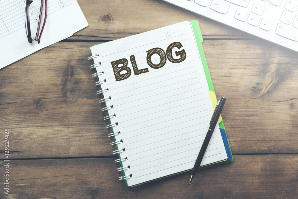 Poster blog word on notepad and keyboard