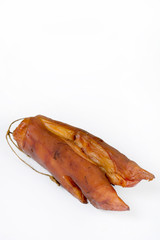 Smoked pork hooves over white background