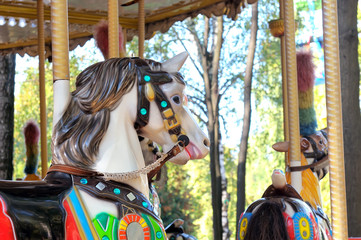 Fototapeta na wymiar Beautifully painted colorful carousel horses