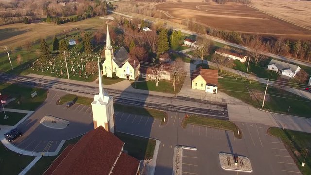 Two scenic rural Churches, old and new together, early morning.
