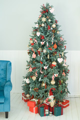 Christmas tree with toys and gifts in interior living room 