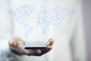 man hand phone on  world map