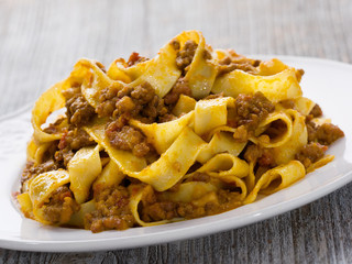 rustic traditional italian pappardelle bolognese