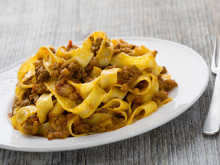 rustic traditional italian pappardelle bolognese
