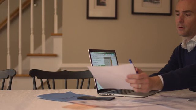 a man stressed over his bills