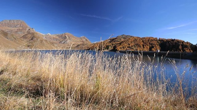 View of lake Ritom in Piora near Gotthard, Canton Ticino of Switzerland with Swiss Alps in the background, Switzerland, Europe. 
