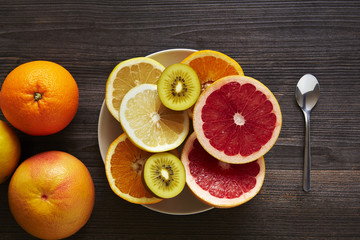 a bowl of sliced citrus fruits
