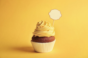 Birthday cupcake with space for text on yellow background