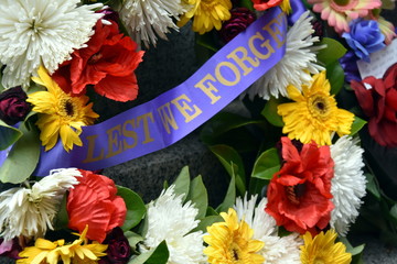 Colorful fresh floral wreaths for Anzac Day memorial celebrations to honor and remember those who...