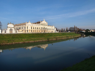 Obraz premium Travel in Italy - Nice view of Villa Pisani and the Brenta River, a famous venetian villas on the Riviera del Brenta, unesco world heritage and italian national museum, in Stra, Veneto, Italy