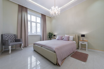 Modern designed bedroom with brick wall