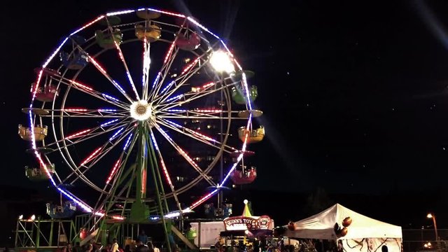 Vibrant Nighttime View of the Illuminated Ferris Wheel in Downtown Miami, Florida