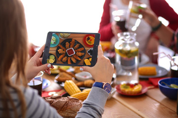 People with drinks while sitting at the dining table