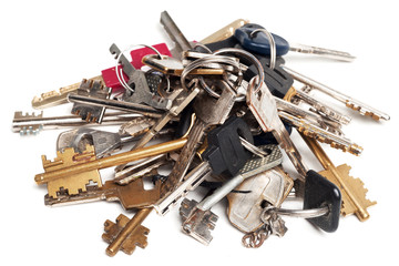 Heap of old keys isolated on white